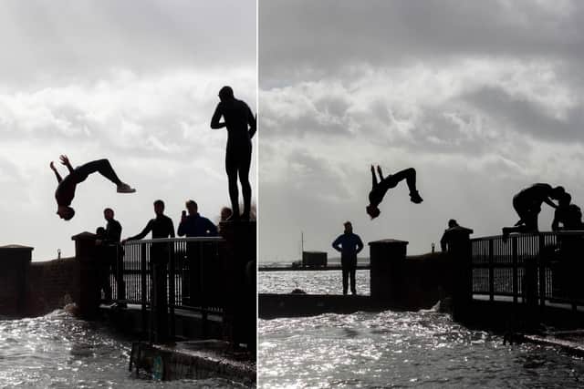 Thrill-seekers pictured backflipping into Emsworth Harbour as Storm Eunice rages. Photo: Habibur Rahman