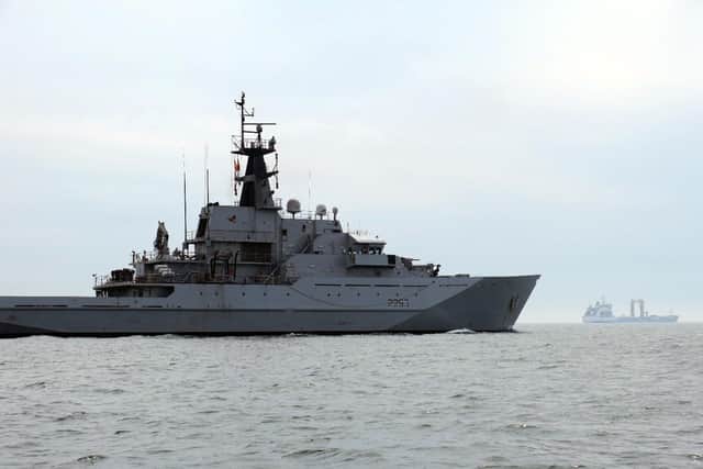 HMS Mersey, pictured front left, with the Russian tanker Akademik Pashin, right.