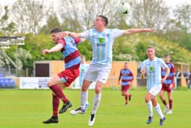 Tom Cain challenges Hamworthy's Matt Neale, left, during the Wessex League Cup final. Picture: Martyn White.