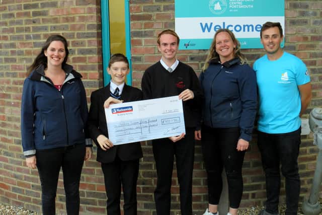 Andrew Simpson Watersports Centre cheque presentation
Caption: Joseph Tillotson and Alex Megham present their cheque to the Andrew Simpson Watersports Centre
Credit: Lucy Tillotson