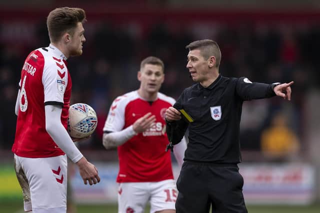 Referee Matthew Donohue and Fleetwood players on Saturday. Photo by Daniel Chesterton/phcimages.com