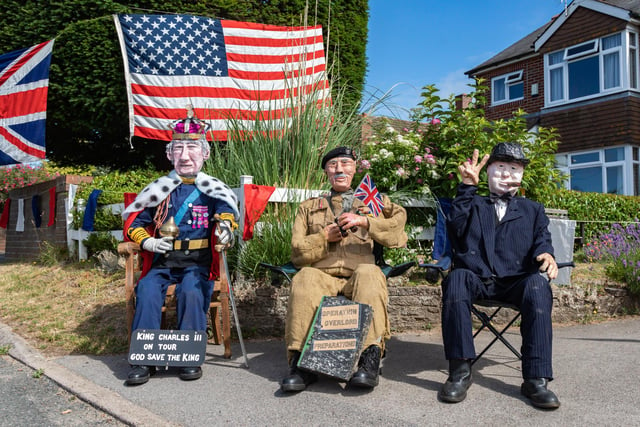 A roadside display for the convoy as it passed through North Boarhunt, featuring King Charles and wartime leaders Field Marshal Montgomery and Winston Churchill. Picture: Mike Cooter (240623)