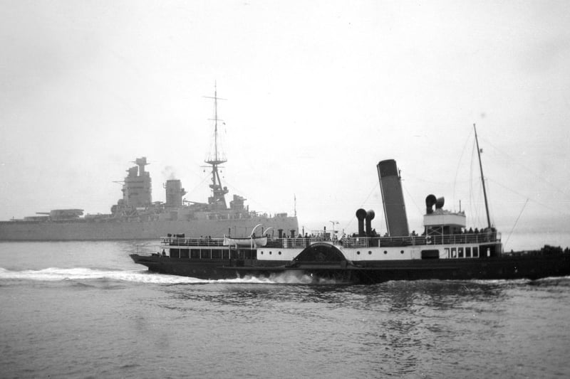 On a misty day the battleship HMS Nelson is overshadowed by the paddle steamer PS Shanklin. Picture: Barry Cox collection