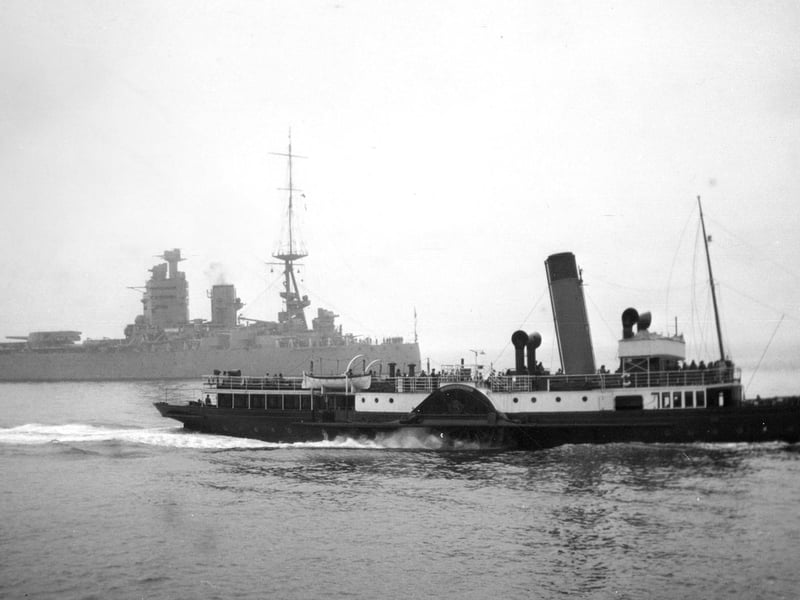 On a misty day the battleship HMS Nelson is overshadowed by the paddle steamer PS Shanklin. Picture: Barry Cox collection