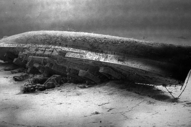 HMS Royal Oak on the seabed at Scapa Flow in the Orkney Islands, Scotland.
HMS Royal Oak was a Revenge-class battleship of the British Royal Navy. Launched in 1914 and completed in 1916, Royal Oak first saw action at the Battle of Jutland. In peacetime, she served in the Atlantic, Home and Mediterranean fleets, more than once coming under accidental attack. The ship drew worldwide attention in 1928 when her senior officers were controversially court-martialled. Attempts to modernise Royal Oak throughout her 25-year career could not fix her fundamental lack of speed, and by the start of the Second World War, she was no longer suited to front-line duty.
The wreck of Royal Oak, a designated war grave, lies in 100 feet of water with her hull 16 feet beneath the surface. In an annual ceremony marking the loss of the ship and crew, Royal Navy divers place a White Ensign underwater at her stern. Unauthorised divers are prohibited from approaching the wreck under the Protection of Military Remains Act 1986.