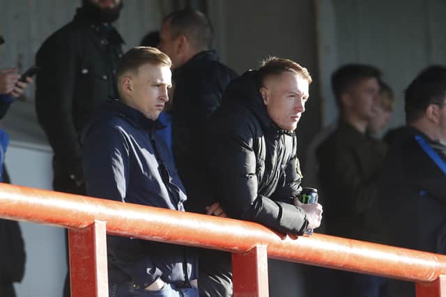 Pompey fans look despondent over what they saw from some of their players at Morecambe.