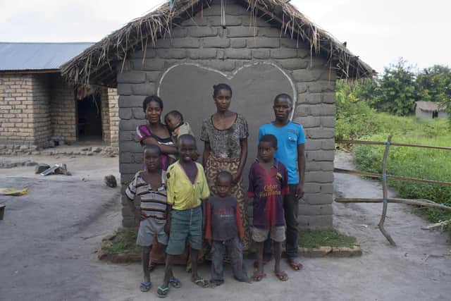 Bawili with her family and their new latrine in Mwandiga Trois, South Kivu, DRC. Waste management firm CSG has shown its support for toilet twinning.