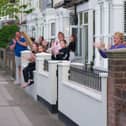 Residents outside their homes in Battenburg Avenue, Portsmouth, taking part in clap for carers. Picture: Habibur Rahman