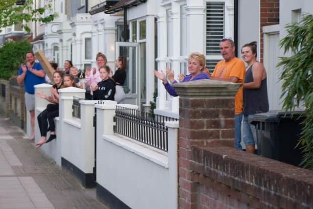 Residents outside their homes in Battenburg Avenue, Portsmouth, taking part in clap for carers. Picture: Habibur Rahman