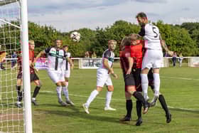 Steve Walker heads Bemerton's second goal at Fleetlands. Picture: Mike Cooter