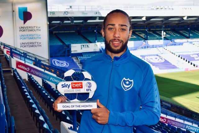Marcus Harness shows off his award