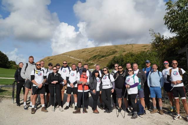 Mammoth walk along the Jurassic Coast raised more than £27,000 in fight against cancer.