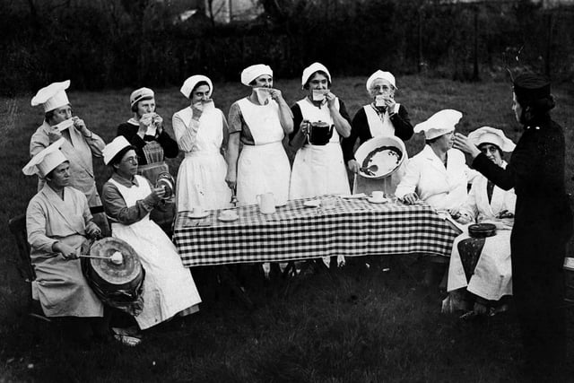 13th November 1935: Some of the kitchen ladies of Hayling Island playing their kitchen utensils as percussion. (Photo by Fox Photos/Getty Images)