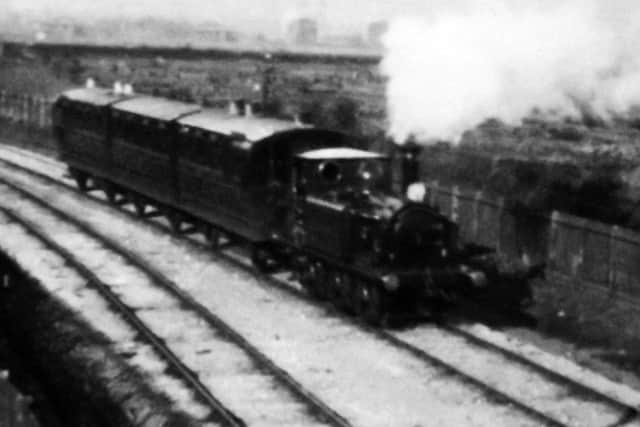 A rare photograph of a train on the East Southsea branch line possibly approaching Jessie Road. Picture: Barry Cox postcard collection.
