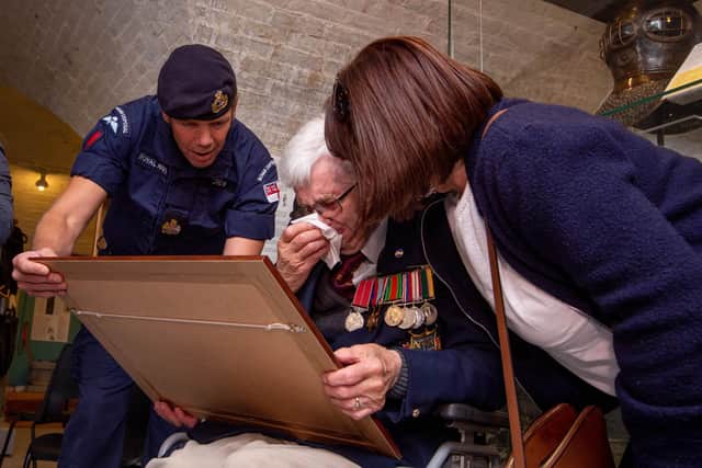 Pictured: John Payne, 96, breaks down in tears as he is presented with a plaque showing old photos of John and his team during the Second World War. 

Picture: Habibur Rahman