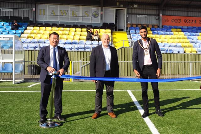 Prad Bains, right, pictured with Havant MP Alan Mak (left) and Havant & Waterlooville FC chairman Derek Pope at the official opening of the club's 3G pitch last October. Picture: Sarah Standing