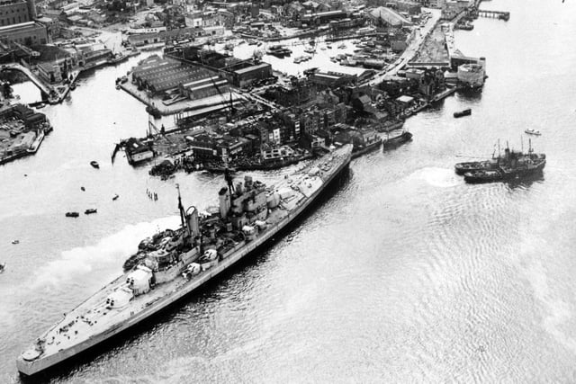 HMS Vanguard runs aground in Portsmouth Harbour after breaking loose but narrowly avoids the Still & West pub,  August 4, 1960. The News PP5335