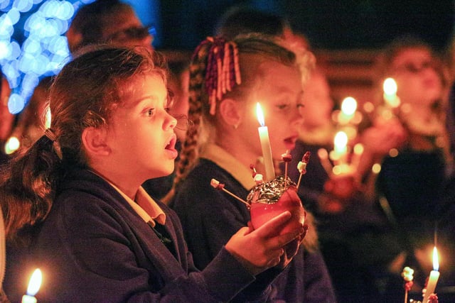 School choir with Christingles. The News Carol Service, St Mary's Church, Fratton, Portsmouth
Picture: Chris Moorhouse (jpns 081223-67)