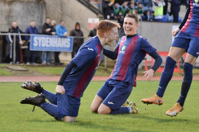 Frankie Paige, left, celebrates after his stunning goal against Millbrook. Pic: Martyn White.