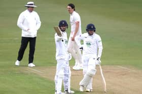 James Vince, left, celebrates reaching 150 next to Liam Dawson during day one of the LV= Insurance County Championship match at Grace Road. Photo by Alex Pantling/Getty Images.