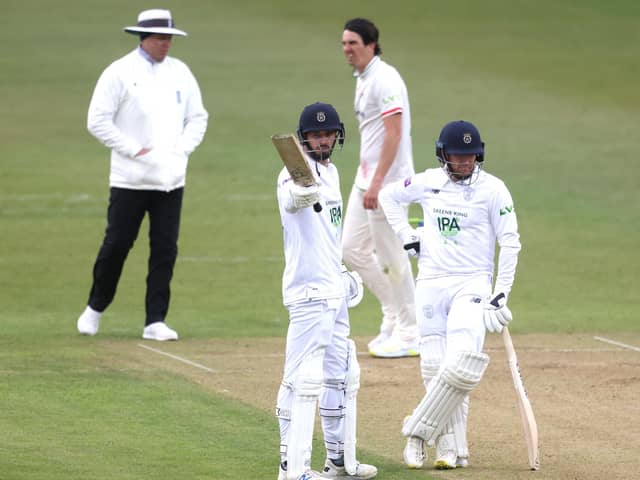 James Vince, left, celebrates reaching 150 next to Liam Dawson during day one of the LV= Insurance County Championship match at Grace Road. Photo by Alex Pantling/Getty Images.