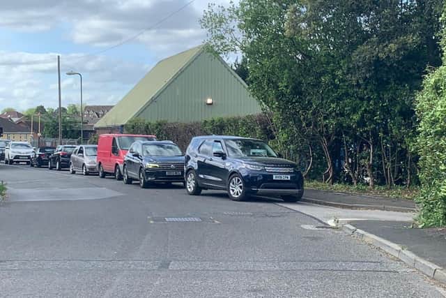 Bishop's Waltham Household Waste Recycling Centre reopened on May 11 after government said local authorities should reopen tips. The queue is interspersed with parked cars. Picture: Sarah Standing