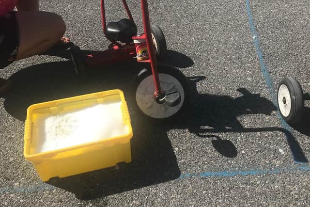 A trike being cleaned down at St George’s Beneficial C of E Primary School.