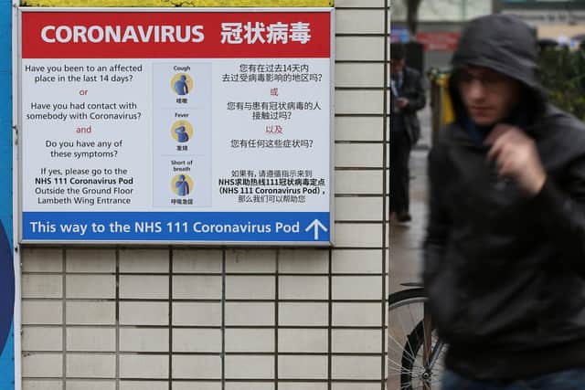 A sign directs patients towards an NHS 111 coronavirus (Covid-19) pod. Picture: ISABEL INFANTES/AFP via Getty Images