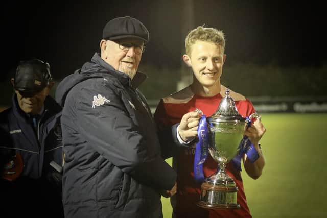 Horndean skipper Ash Howes with the Wessex League trophy. Picture by Martin Denyer