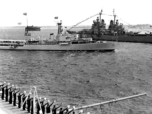 HMS Surprise passes USS BaltimoreDuring the 1953 Fleet Review HMS Surprise passes between the USS Baltimore and HMS Vanguard.