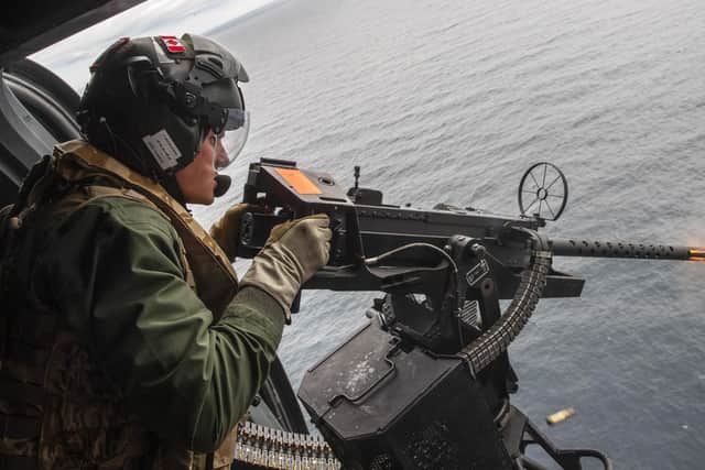 Pictured: 814 Naval Air Squadron take part in a small arms firing at sea whilst on maritime security patrols in around around UK waters with HMS Kent.