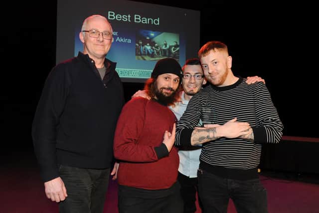 Seething Akira picking up their Best Band trophy at The Guide Awards, January 2019, from The Wedgewood Rooms' Geoff Priestley, left.
Picture: Sarah Standing (280119-7526)