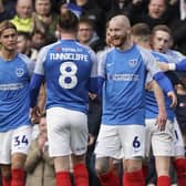 The Pompey players celebrate Ronan Curtis' 26th-minute striker against Cheltenham