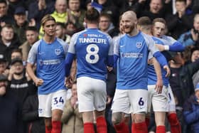 The Pompey players celebrate Ronan Curtis' 26th-minute striker against Cheltenham