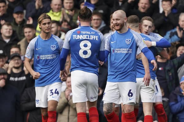 The Pompey players celebrate Ronan Curtis' 26th-minute striker against Cheltenham