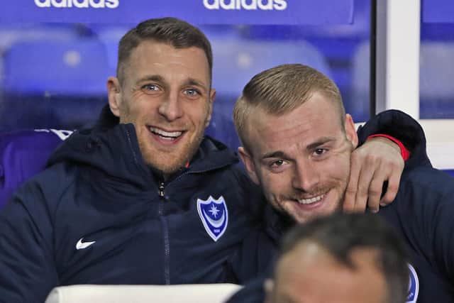 Lee Brown and Jack Whatmough are all smiles on Pompey's bench ahead of February's St Andrew's encounter with Birmingham. Picture: Kieran Cleeves/ProSportsImages