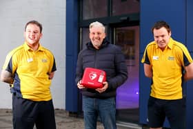 Stuart Hoare, centre, had a heart attack at Horizon Gym, Havant Leisure Centre. His life was saved by a combination of CPR and use of the defibrillator that he is holding, by senior centre attendant Reece Parsons, left, and duty manager Mike Davies.