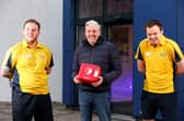 Stuart Hoare, centre, had a heart attack at Horizon Gym, Havant Leisure Centre. His life was saved by a combination of CPR and use of the defibrillator that he is holding, by senior centre attendant Reece Parsons, left, and duty manager Mike Davies.