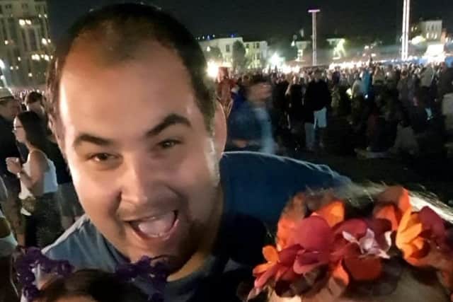 Adrian Heath, 32, with friends at last year's festival. Adrian feels it's important people transfer their tickets to help ensure next year's festival.