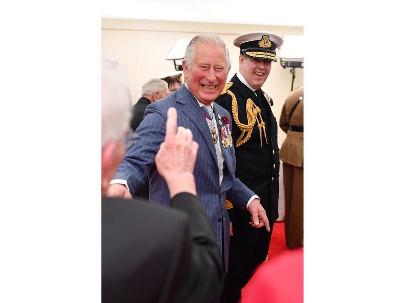 Britain's Prince Charles, Prince of Wales (C) reacts as he meets veterans during an event to commemorate the 75th anniversary of the D-Day landings, in Portsmouth on June 5, 2019.