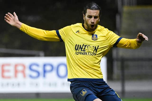 Christian Burgess in action for Royale Union Saint-Gilloise. Picture: LAURIE DIEFFEMBACQ/BELGA MAG/AFP via Getty Images)