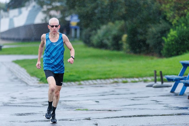 Runners hit the streets in wet and windy conditions despite The Great South Run being cancelled.