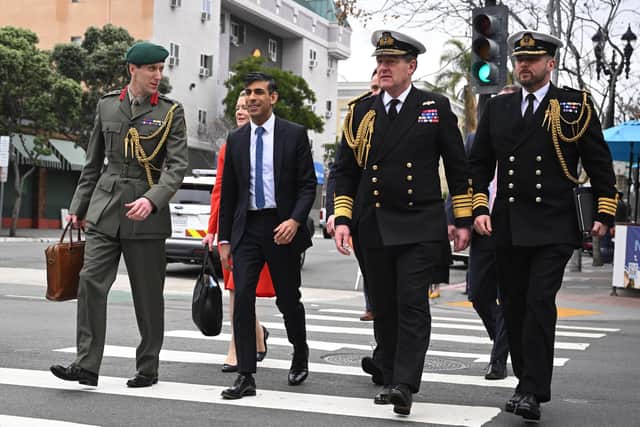 First Sea Lord Admiral Sir Ben Key KCB CBE gave further details about maintaining the fleet while the Type 26 and Type 31 programmes are continuing. Pictured is Prime Minister Rishi Sunak and Colonel Jaimie Norman, the Prime Minister’s Military Attache (L),  First Sea Lord Admiral Sir Ben Key KCB CBE (2nd R) and Royal Navy Captain Gus Carnie (R) on March 13, 2023 in San Diego, California. Picture: Leon Neal/Getty Images.