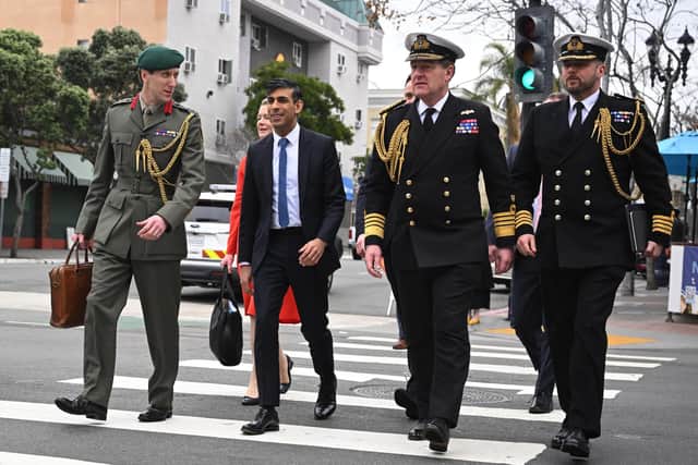First Sea Lord Admiral Sir Ben Key KCB CBE gave further details about maintaining the fleet while the Type 26 and Type 31 programmes are continuing. Pictured is Prime Minister Rishi Sunak and Colonel Jaimie Norman, the Prime Minister’s Military Attache (L), First Sea Lord Admiral Sir Ben Key KCB CBE (2nd R) and Royal Navy Captain Gus Carnie (R) on March 13, 2023 in San Diego, California. Picture: Leon Neal/Getty Images.