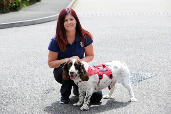Kerry Snuggs from Titchfield Common, has been chosen as a baton bearer for the Queen's Baton Relay 2022 on Wednesday, July 6, in Portsmouth. She is pictured with her Springer Spaniel cross with Bassett Hound Bert, nine 
Picture: Sarah Standing (300622-7340)