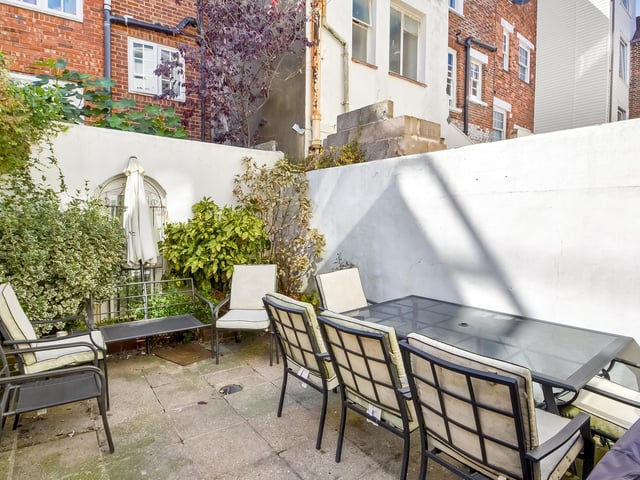 The property features a courtyard garden.