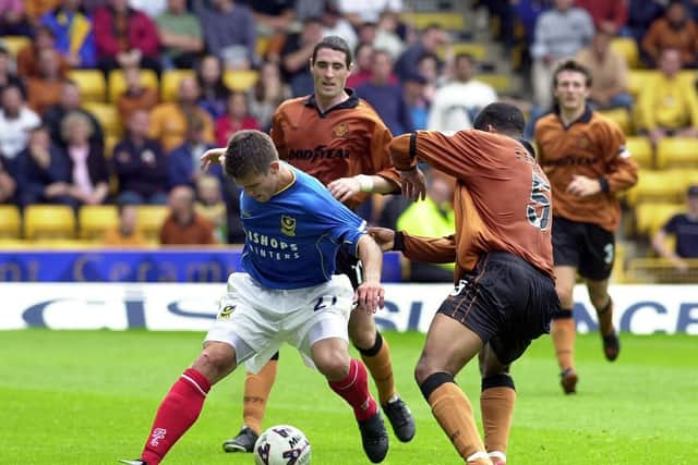 Stefani Miglioranzi tangles with Wolves' Joleon Lescott and Mark Kennedy in January 2001. Picture: Steve Reid.