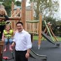Havant MP Alan Mak with children enjoying the Springwood Avenue Play Area in Stakes