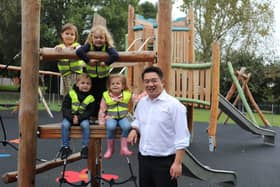 Havant MP Alan Mak with children enjoying the Springwood Avenue Play Area in Stakes