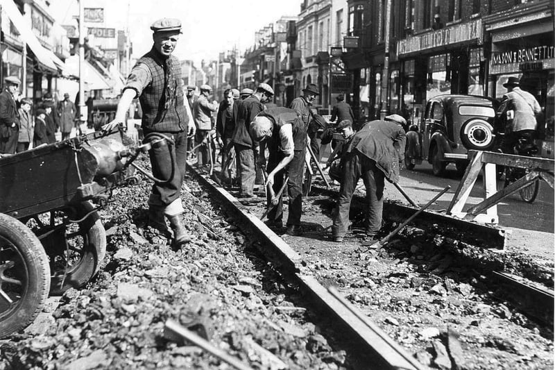 Taking up tram tracks for iron, early 1940, North End, Portsmouth